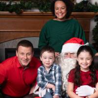 Family of four with Santa.